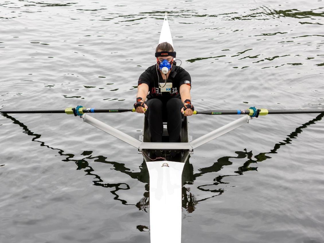 Student rowing wearing measurement gear